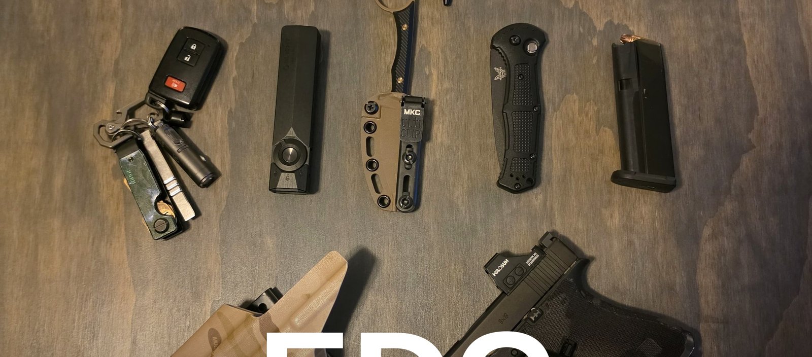 Top-down flat lay of the host's everyday carry